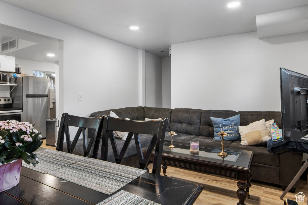 Living room featuring recessed lighting and wood finished floors