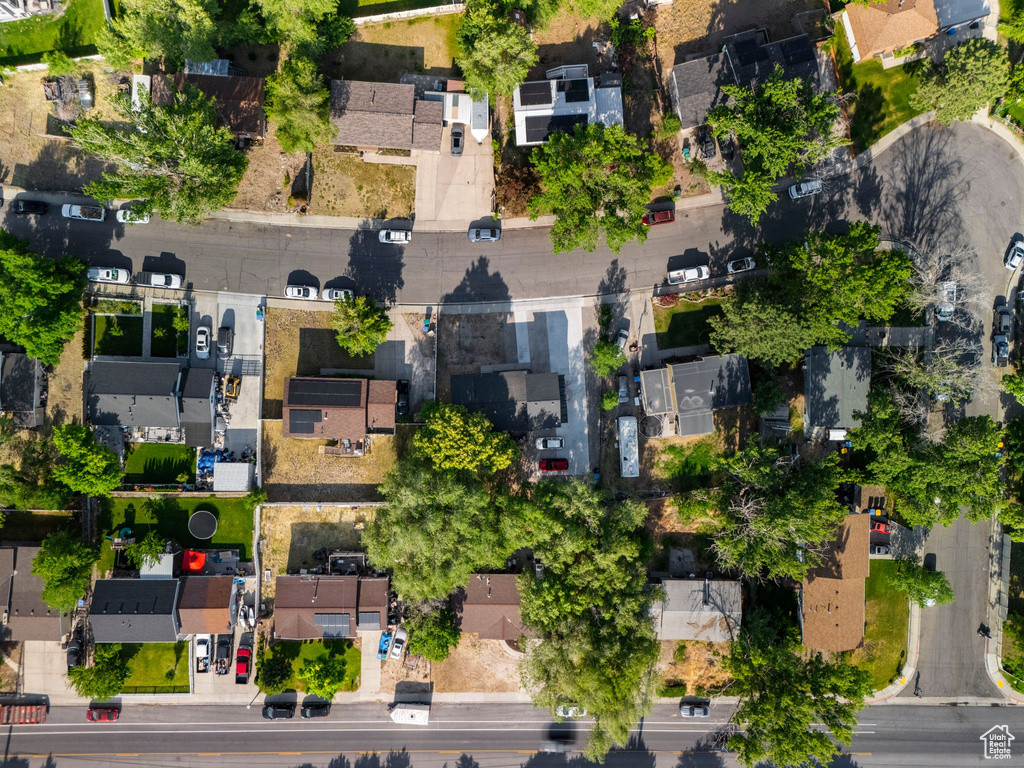 Aerial view of property and surrounding area with nearby suburban area