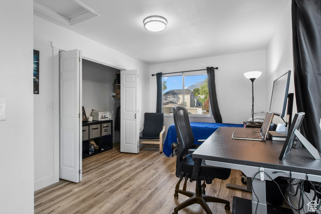 Office space featuring light wood-type flooring and baseboards