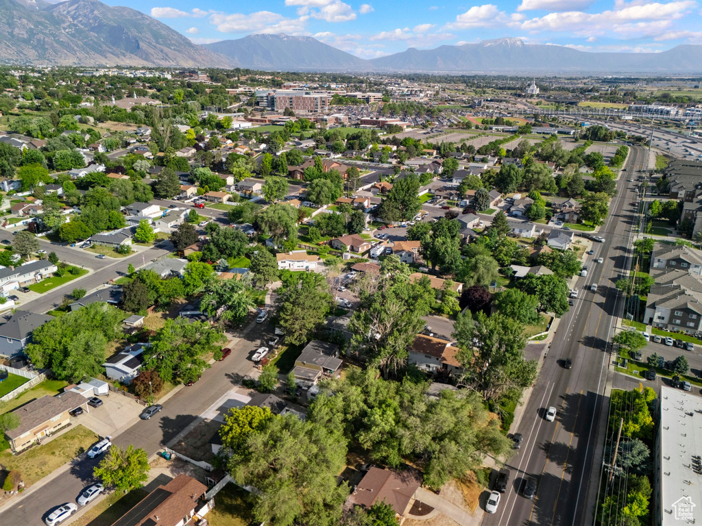 View of property location with mountains and nearby suburban area
