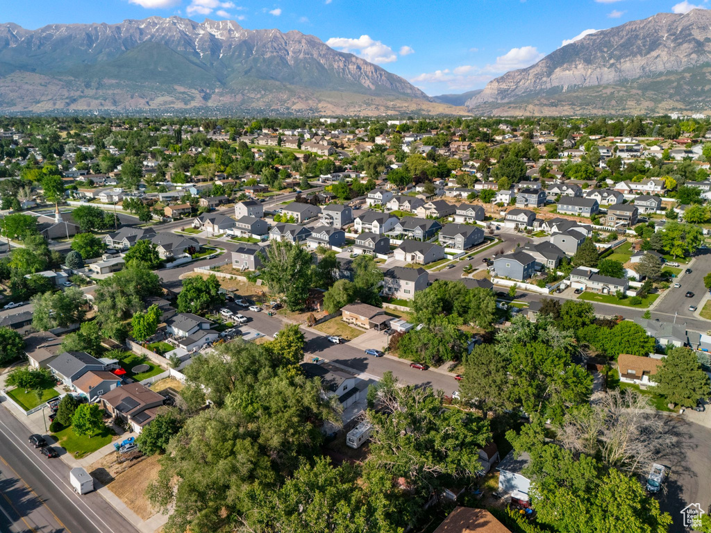 Aerial view of property\\\'s location featuring a mountain backdrop and nearby suburban area