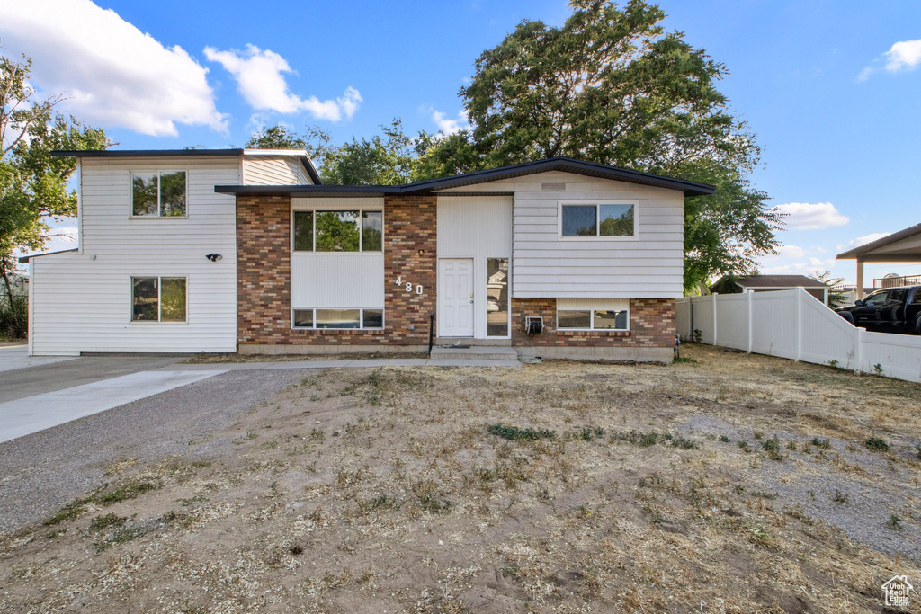 View of front of home with brick siding and entry steps