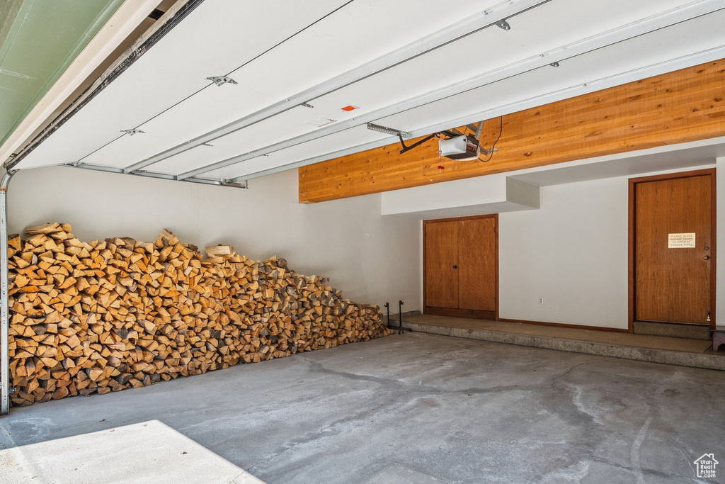 Garage featuring a garage door opener