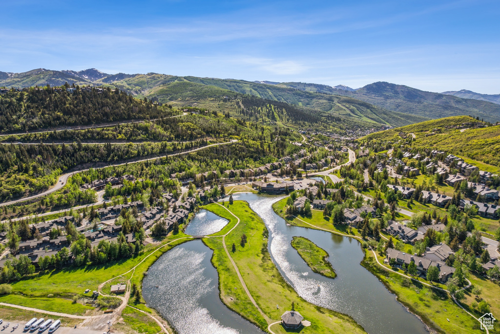 Aerial view of residential area featuring a water and mountain view