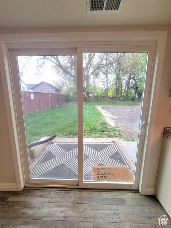 Doorway to outside with hardwood / wood-style flooring
