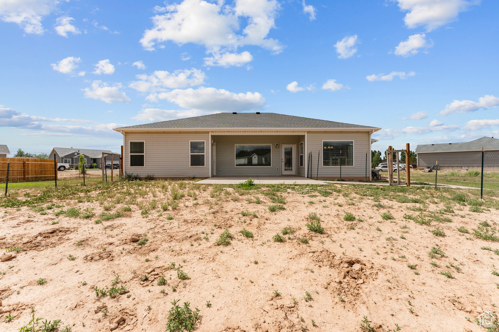 Rear view of property with a patio area