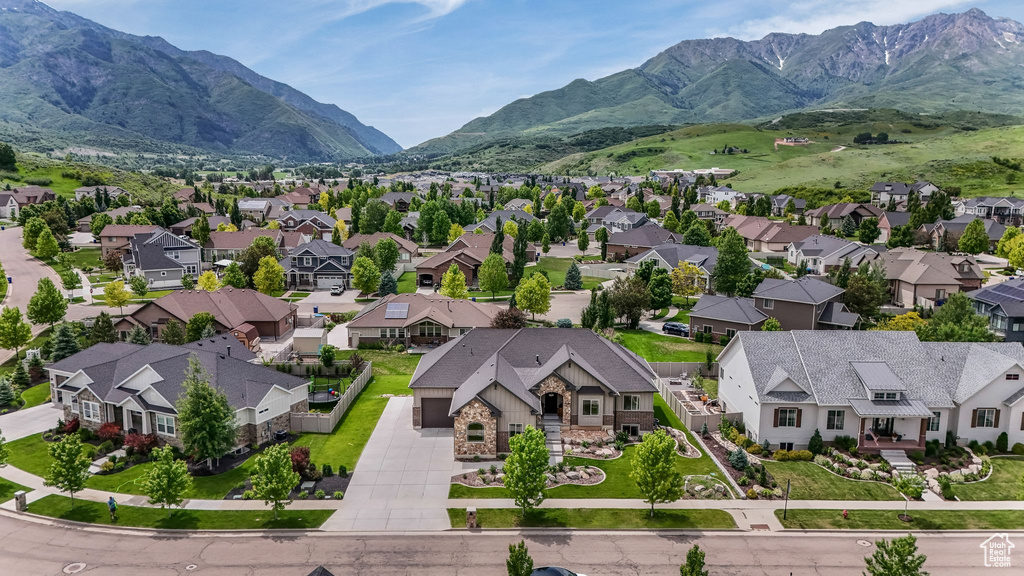 Aerial perspective of suburban area with a mountainous background
