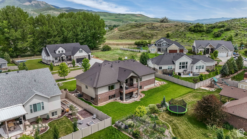 Aerial view of residential area with a mountainous background