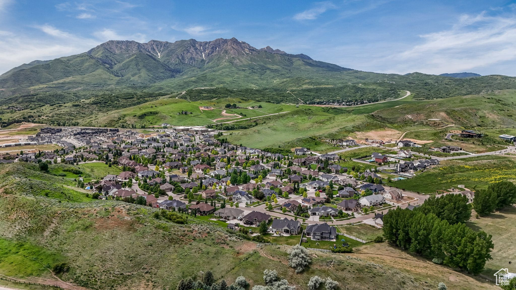 View of mountain backdrop featuring nearby suburban area
