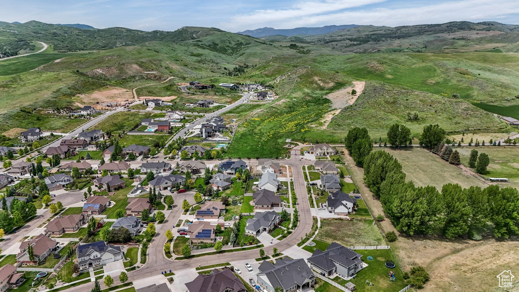 View of property location with mountains and nearby suburban area