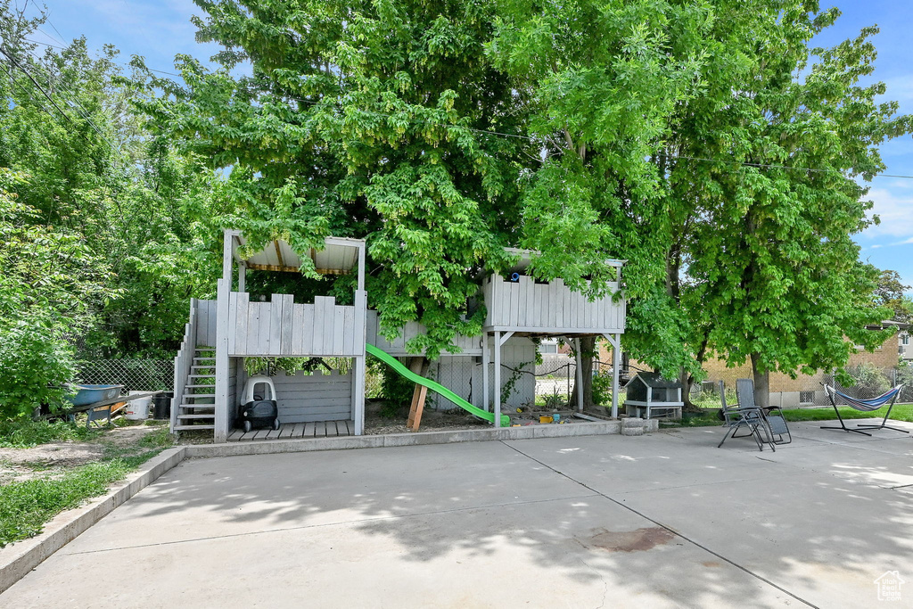 View of community featuring a playground and stairway