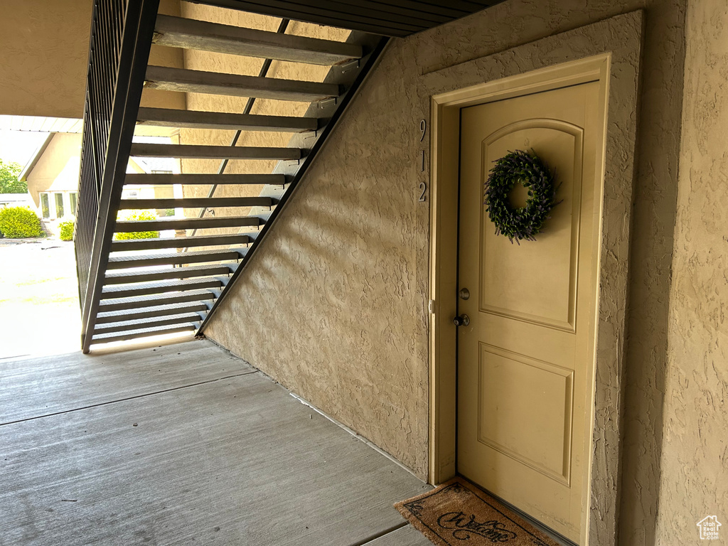 Property entrance with stucco siding