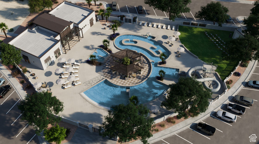 Aerial view of property and surrounding area featuring a pool