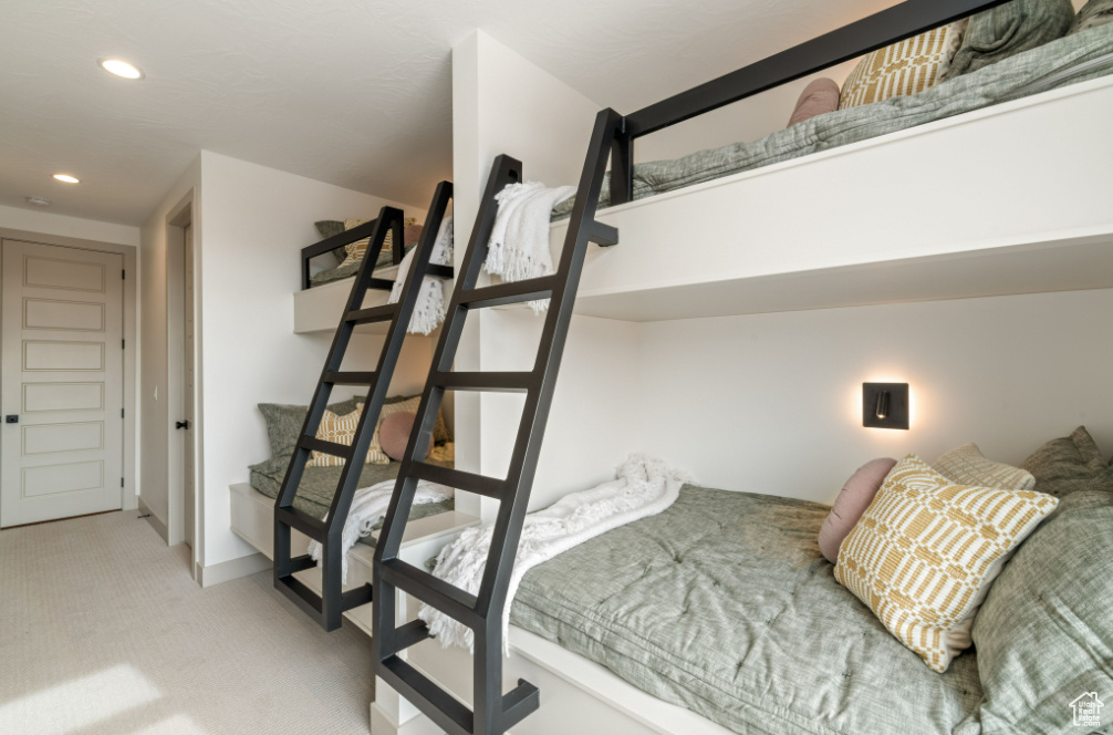Bedroom featuring carpet flooring, recessed lighting, and baseboards
