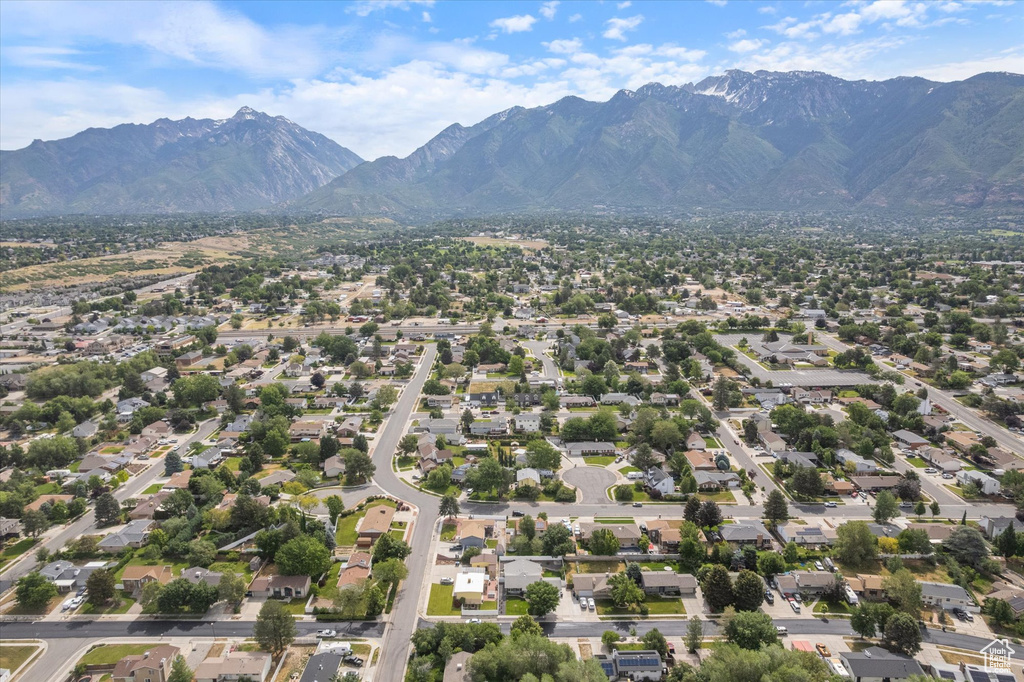 Aerial perspective of suburban area with a mountainous background