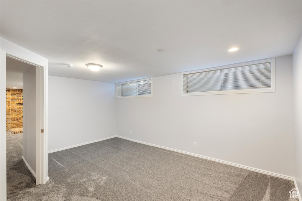 Finished basement featuring carpet flooring, baseboards, and recessed lighting