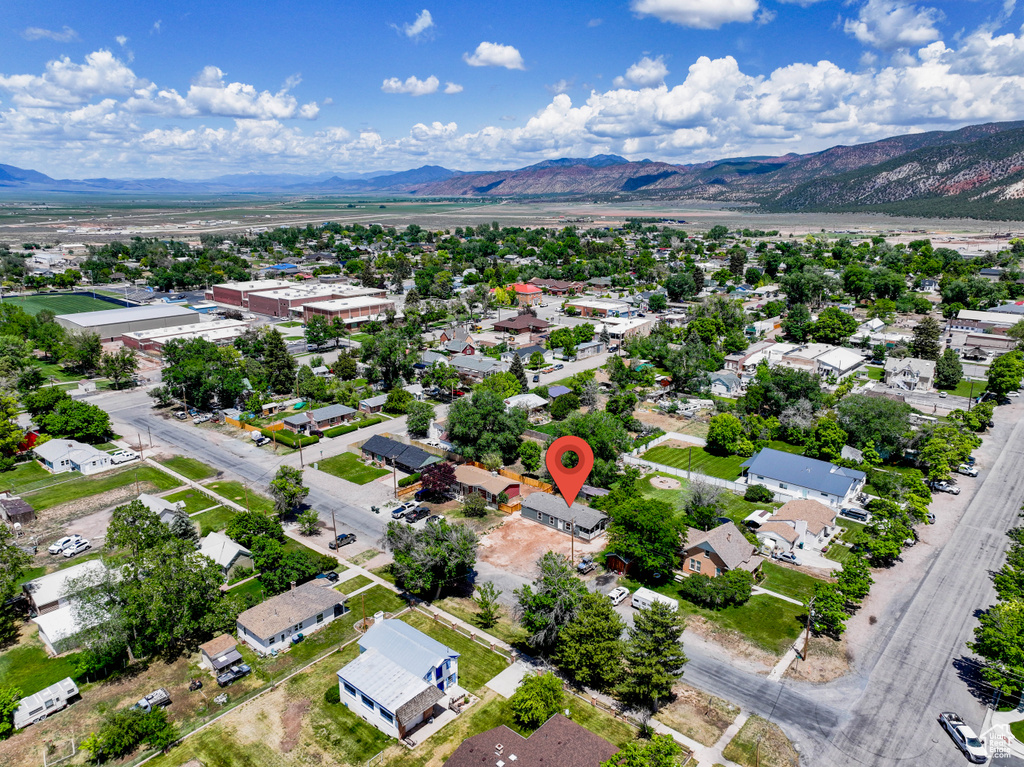 Aerial perspective of suburban area featuring a mountain backdrop
