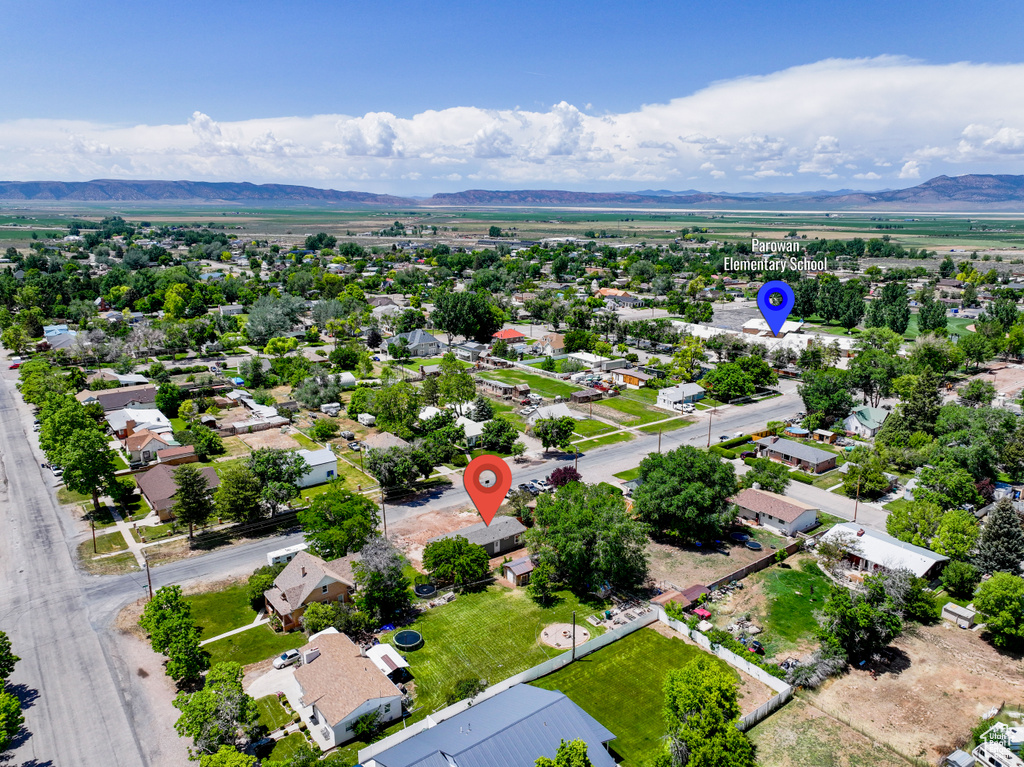 Aerial view of residential area with a mountain backdrop