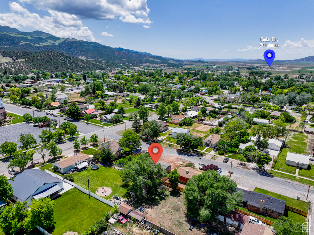 Aerial perspective of suburban area with a mountain backdrop