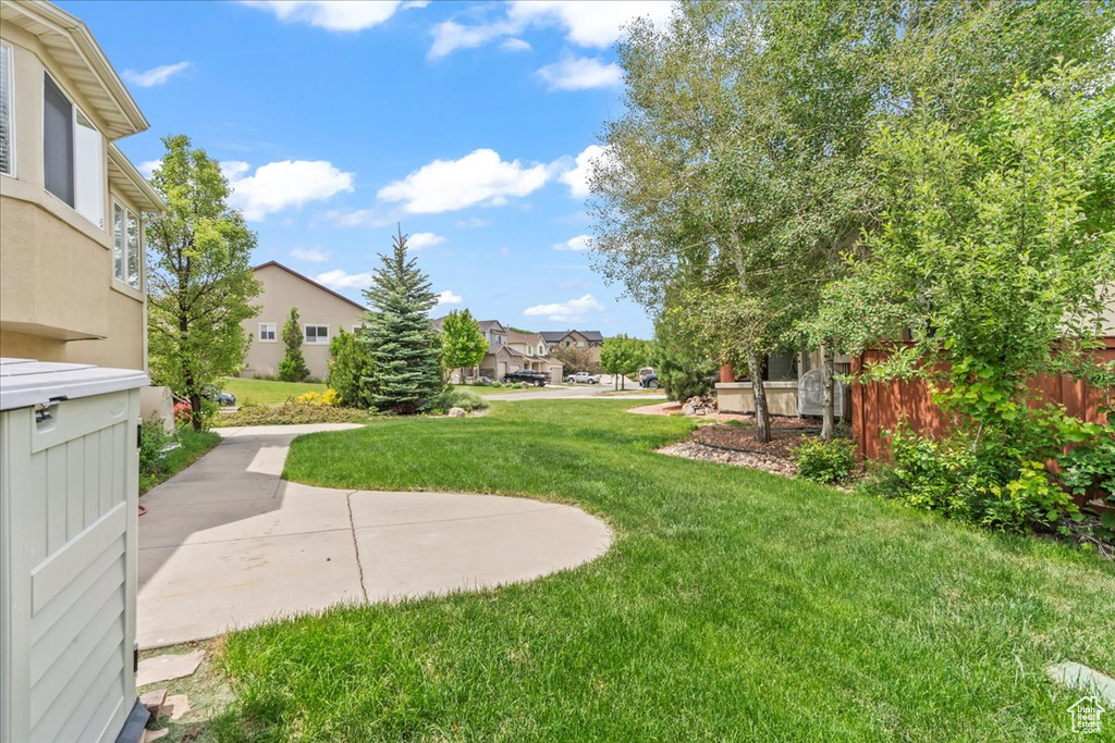 View of grassy yard featuring a residential view