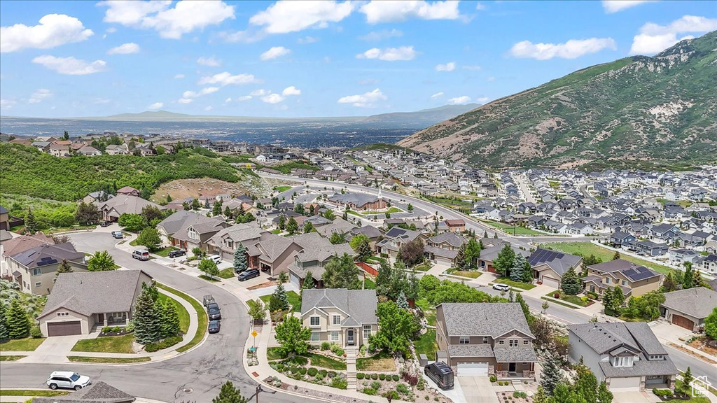 Aerial view of residential area featuring a mountain backdrop
