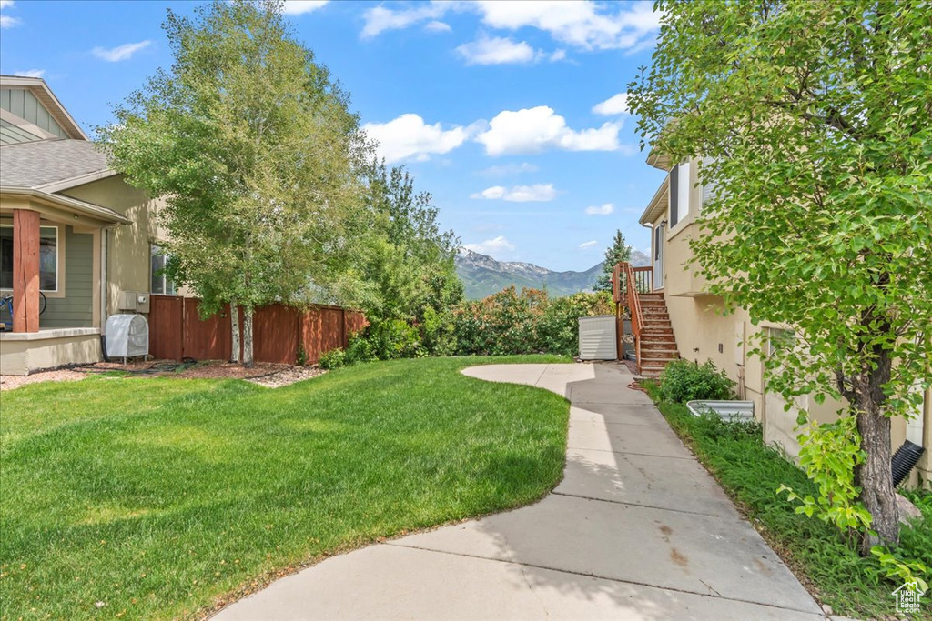 View of yard featuring stairway and a mountain view