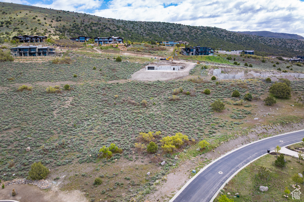 Aerial view of property's location featuring mountains