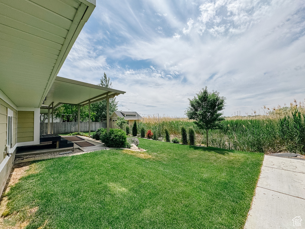View of yard with a patio