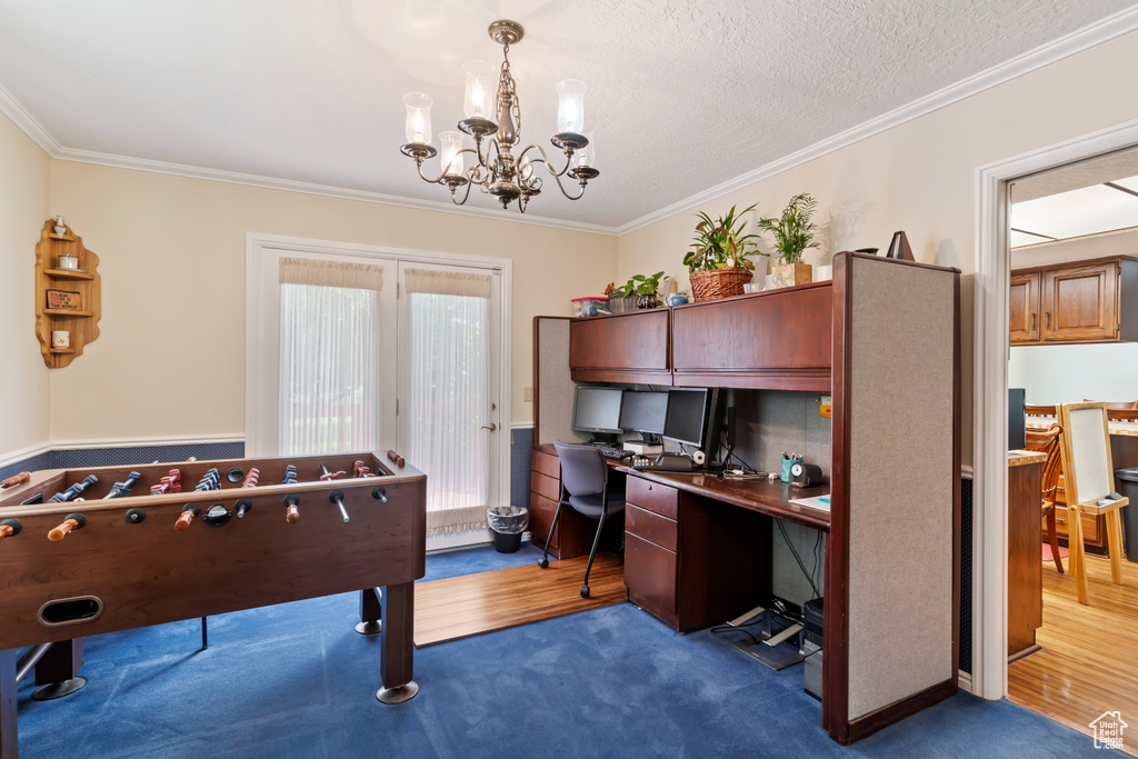 Office space featuring crown molding, a chandelier, and carpet