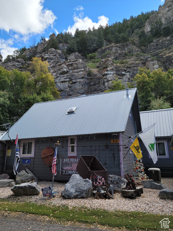 View of outbuilding featuring central AC unit