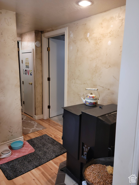 Corridor featuring wood finished floors