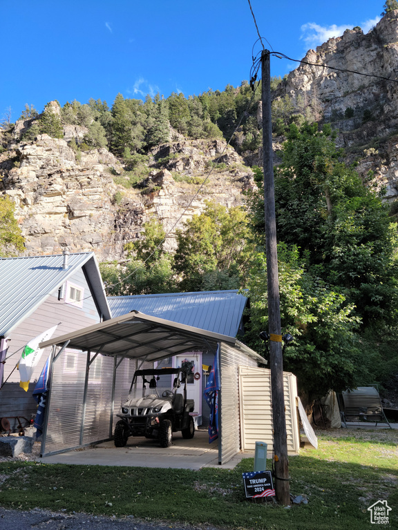 View of parking with a carport