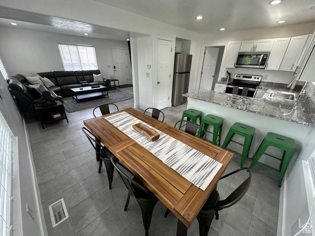 Dining area featuring recessed lighting