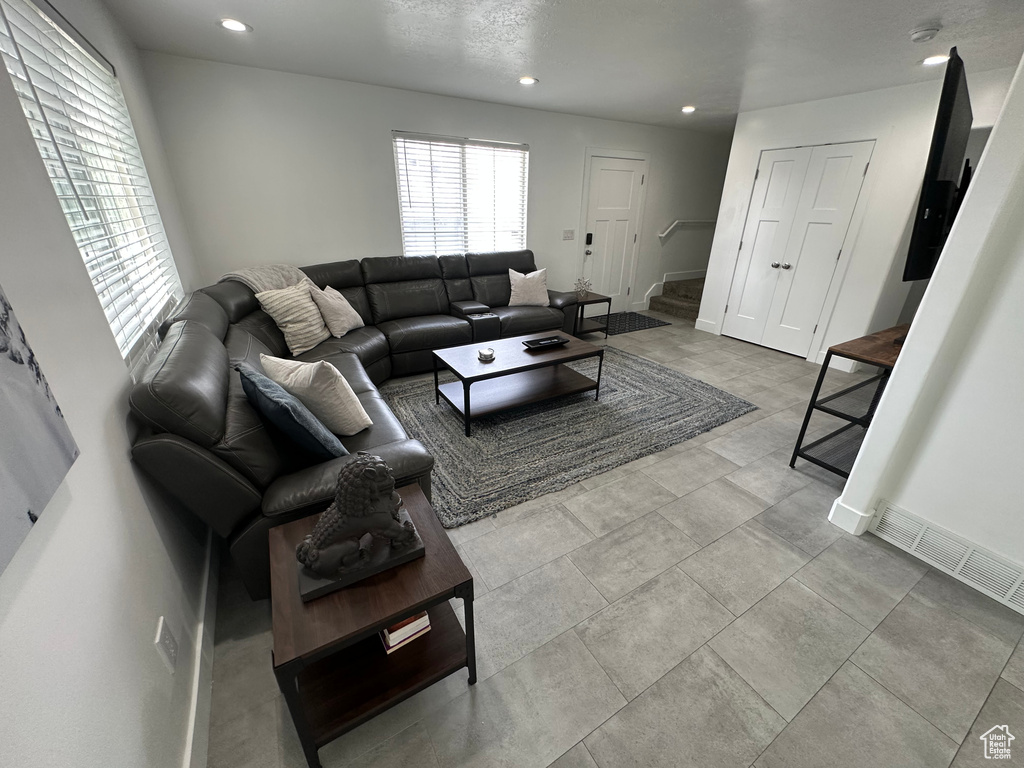 Living room featuring recessed lighting and baseboards