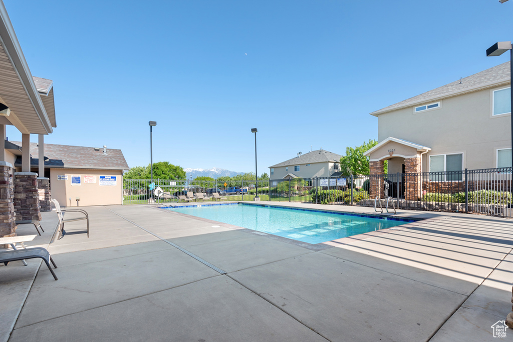 Community pool featuring a patio