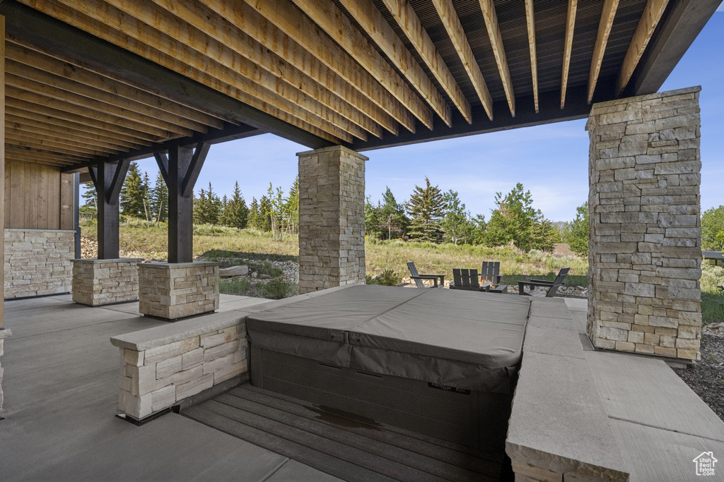 View of patio / terrace with a covered hot tub