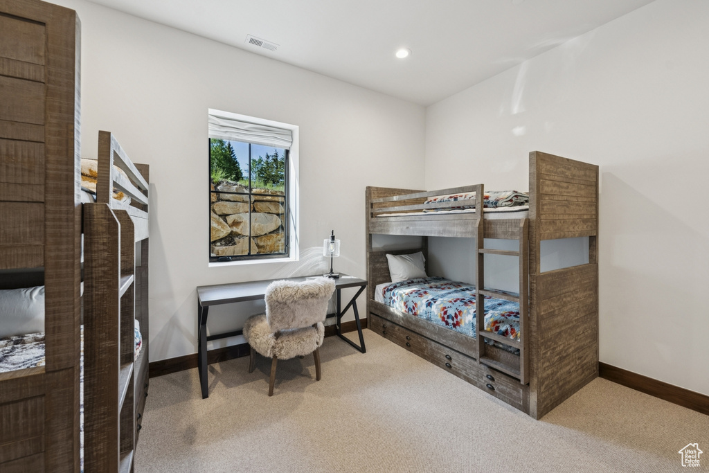 Carpeted bedroom with baseboards and recessed lighting