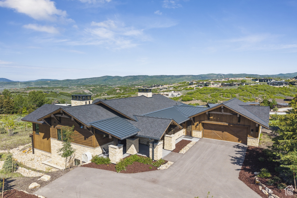 View of subject property featuring a mountain backdrop