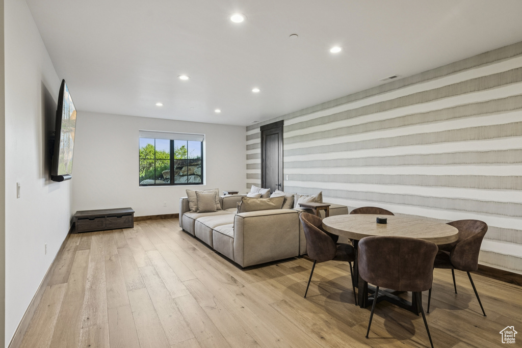 Living room featuring recessed lighting, light wood finished floors, and baseboards