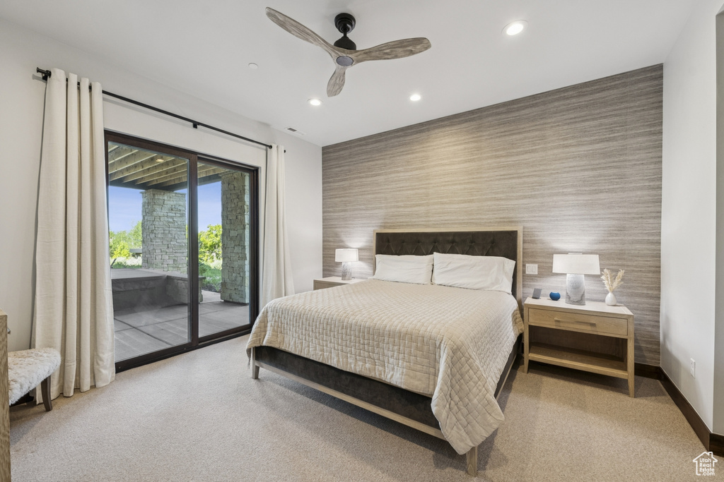 Bedroom with an accent wall, wallpapered walls, access to exterior, baseboards, and recessed lighting