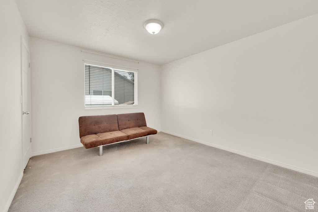 Unfurnished room with carpet floors and baseboards