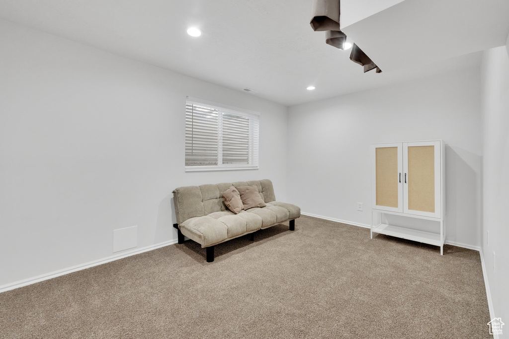 Living area featuring carpet, recessed lighting, and baseboards