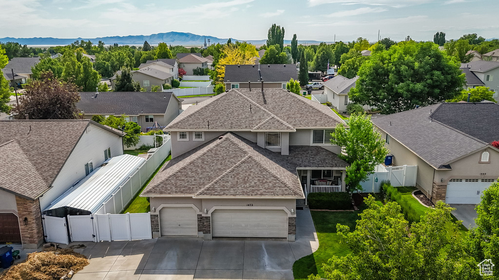 Aerial perspective of suburban area featuring a mountainous background