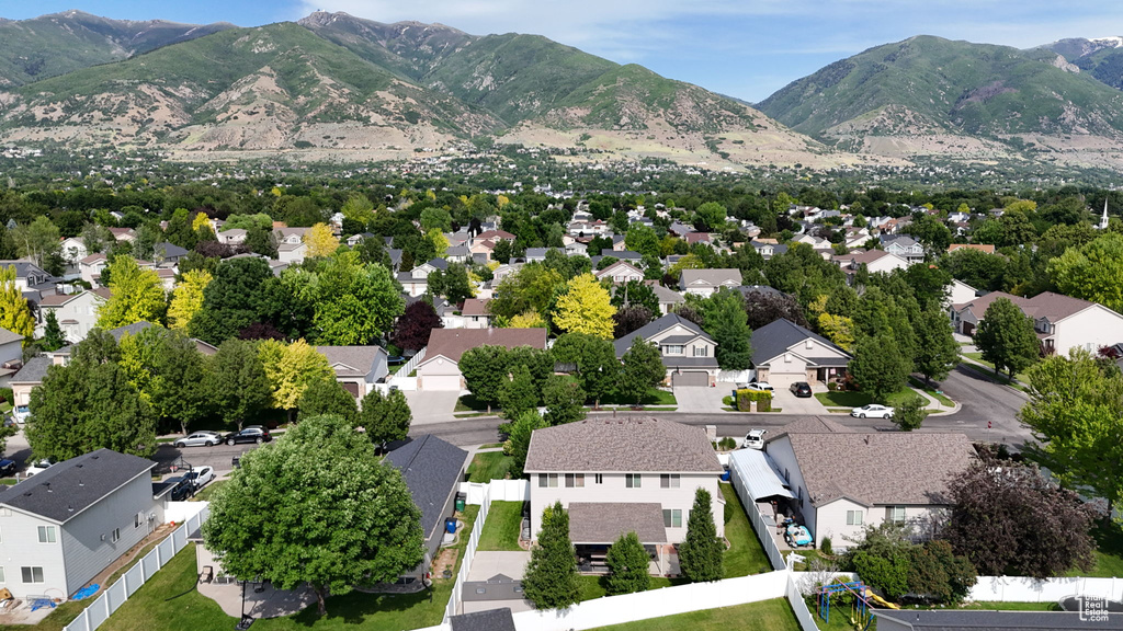 Aerial view of residential area featuring a mountain backdrop