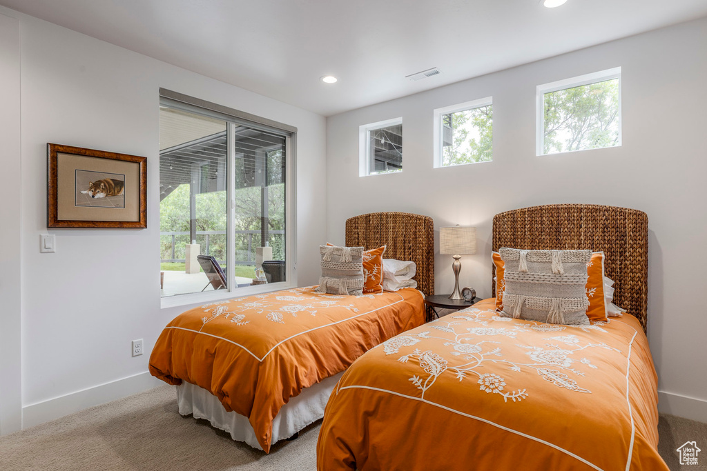 Carpeted bedroom featuring baseboards and recessed lighting