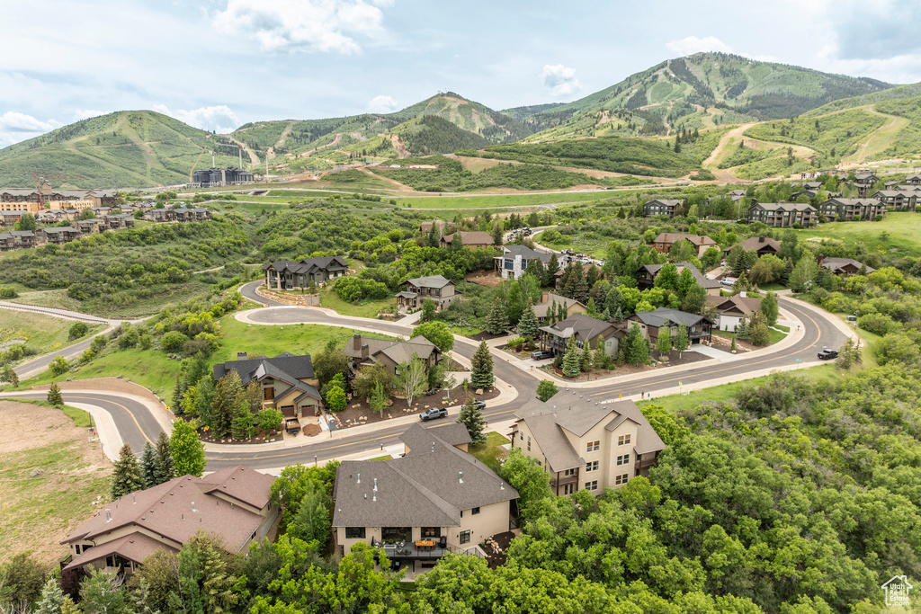 Aerial view of residential area with a mountainous background