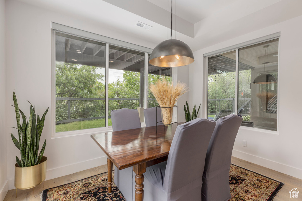 Dining room featuring baseboards and light wood-style flooring