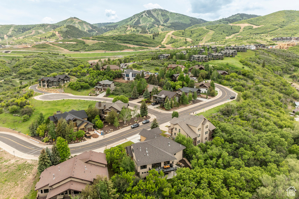 Aerial perspective of suburban area featuring a mountainous background