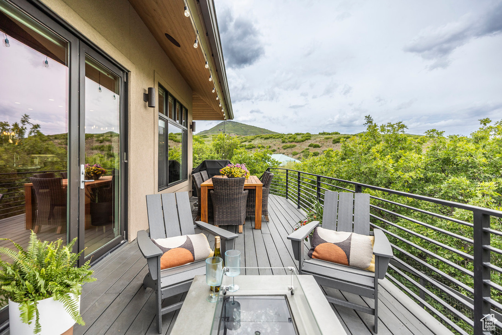 Wooden deck featuring a mountain view