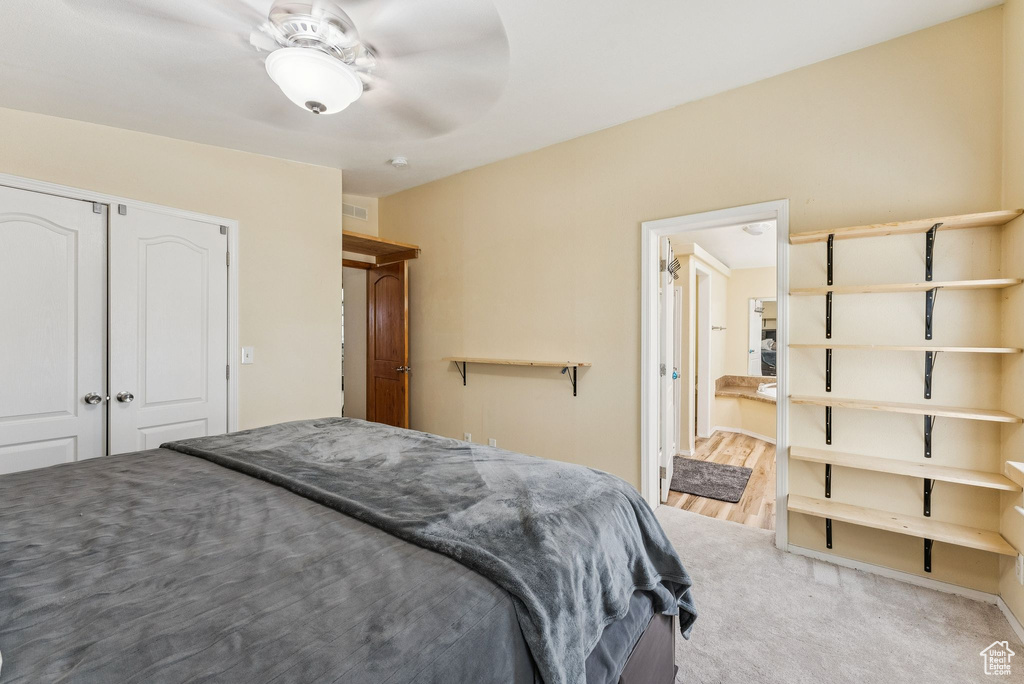 Bedroom with a closet and ceiling fan